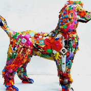 Image of colorful dog sculpture made from recycled materials.